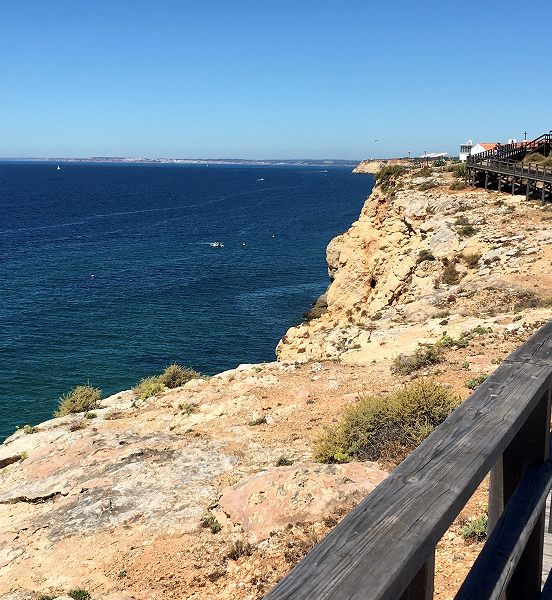 Cliffside boardwalk overlooking Algarve's coastline